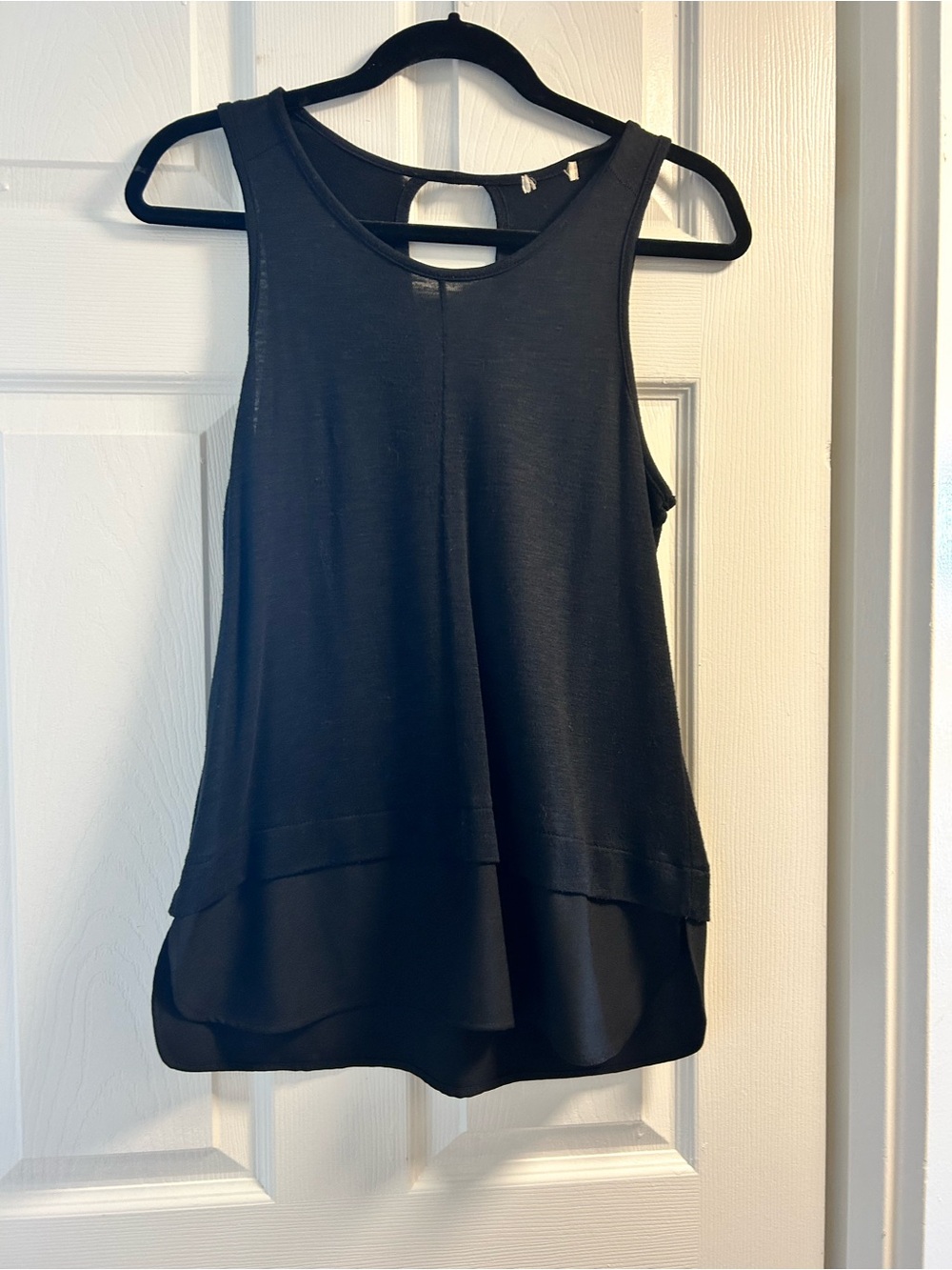 Black Sleeveless Layered peplum Tank Top with twill bottom.